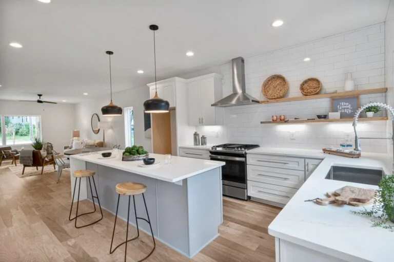 White kitchen with island and pendants
