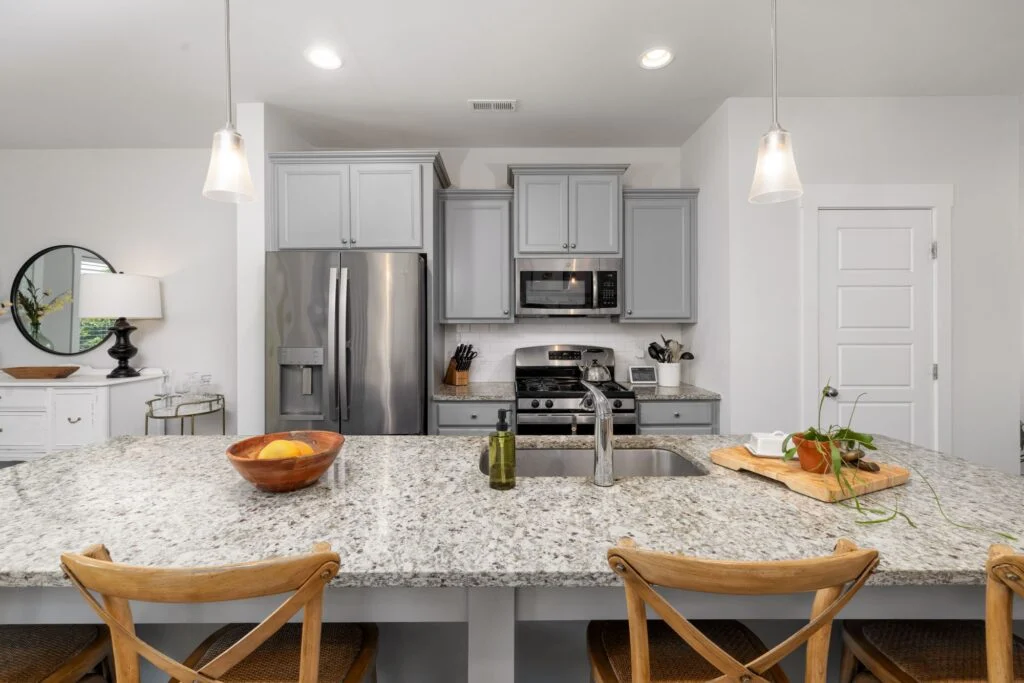 2214 Saddlewren Lane, Fort Worth: White kitchen with island seating
