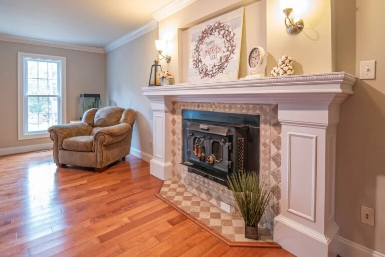 Den with brick fireplace