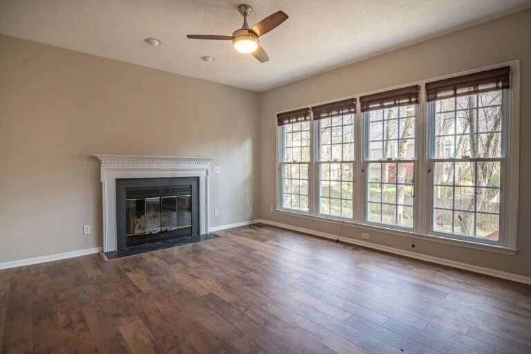 Living room with fireplace and wide windows