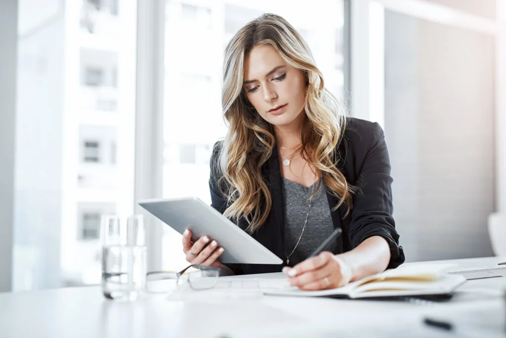 Avery Hale looking over a listing on her tablet